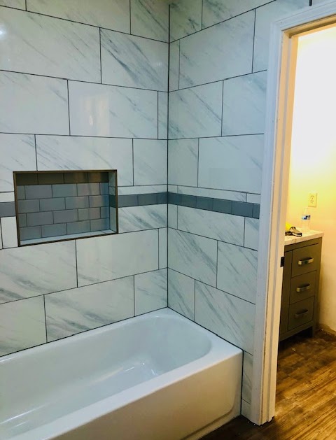 Bathroom After - Premium travertine and walk-in shower